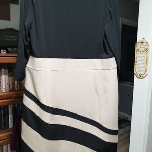 One piece dress Black, tan bottom, swooped neckline.
